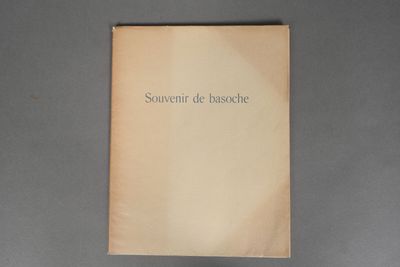 the book is open on a gray surface with a black and white picture