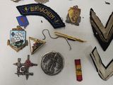 many different types of badges on a white surface