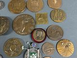 a lot of coins that are laying on a table