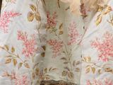 a close up of a dress with ruffles on it