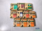 a pile of coffee bags sitting on a table