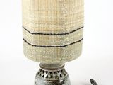 a lamp that is sitting on a table next to a cord