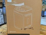 the box of a toaster is sitting on a wooden table