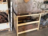 a pile of junk in a garage next to a pile of boxes