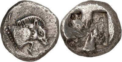 a silver coin with a head of a horse on it