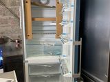 a refrigerator that has been left open in a room