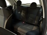 the back seats of a car are black and grey in color