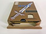 a box with a knife inside of it on a white surface