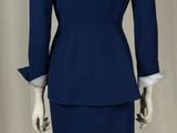 an image of a mannequin dressed in a blue suit and skirt