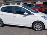 a white car parked in a parking lot next to other cars