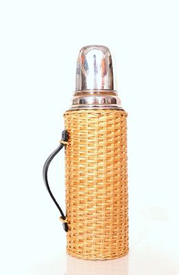 a bottle with a handle on a white surface