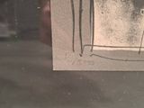 a picture of a drawing on a piece of paper in a window