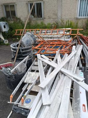 a pile of construction materials sitting outside of a building