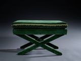 an image of a green bench with a green cushion on top of it