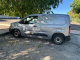 a silver van parked on the side of the road