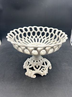 a white bowl that is on a black table