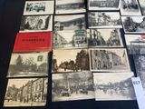several old black and white photographs of buildings and buildings on a table