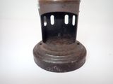 a small metal object that is on a white surface