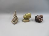 three different types of figurines are displayed on a white surface