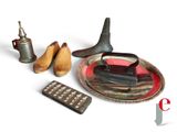 a plate with a pair of shoes and a plate with a pair of pears on it
