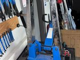 a picture of a garage with tools hanging on the wall