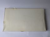 an old piece of paper sitting on top of a white table