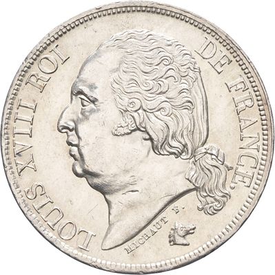 une vieille pièce d'argent sur laquelle figure le portrait d'un homme