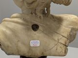marble bust of a woman with a bird on her head
