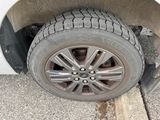a tire on the side of a car with a flat tire