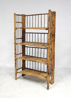 an image of a bamboo shelf with four shelves on top of it