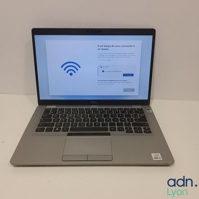an open laptop computer sitting on top of a white table