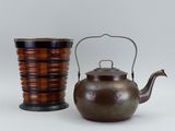 two tea pots and a tea kettle sitting next to each other