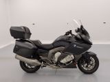 a picture of a black motorcycle parked in a white room