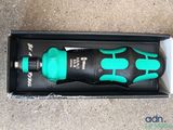 a black and green water bottle in a black box