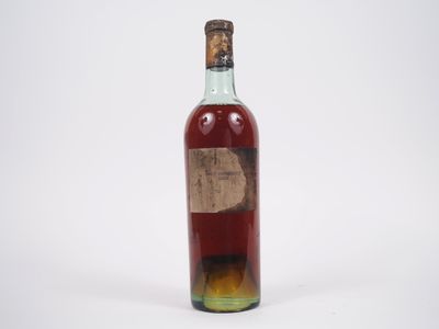 une image représentant une bouteille d'alcool avec une étiquette dessus