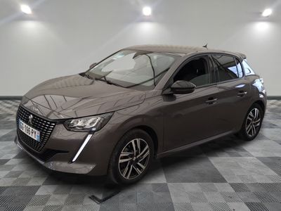 the grey car is parked on a checkered floor in a garage