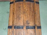 a large wooden barrel hanging from the ceiling