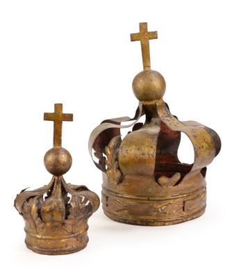 pair of gold crowns with crosses on top of them on a white background