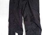 the bottom of a pair of black pants with white logos on them