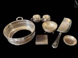 a lot of silver items that are on a table