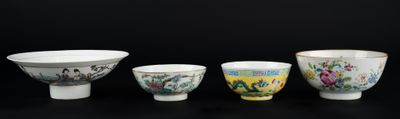 three bowls and a bowl on a table with a black background