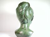 sculpture of a woman ' s head on a white background
