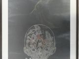 framed photograph of a person with a glass head in a room