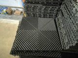 a stack of black and white tiles on the floor