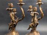 pair of antique bronze candlesticks with cherenshes and flowers