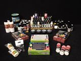 many different types of paint and supplies on the table