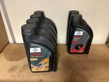 two bottles of motor oil sitting on the floor next to each other