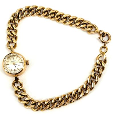 an image of a gold chain bracelet with a watch on it