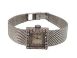 une photo d'une montre-bracelet pour femme sertie de diamants