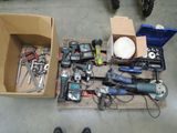 a box full of tools on the floor next to a pair of shoes